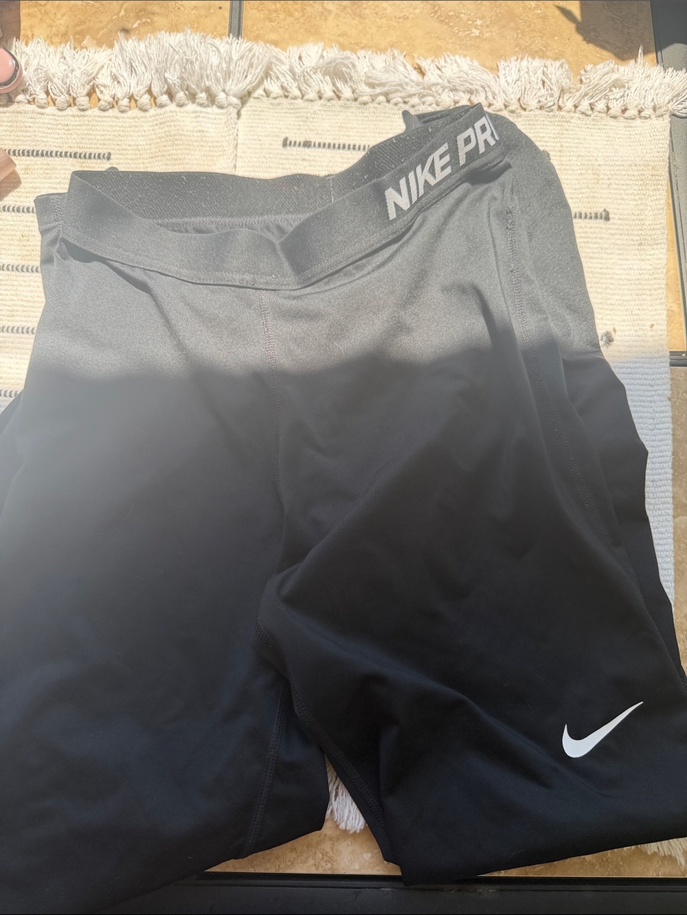 Nike size M Black Leggings with White Swoosh